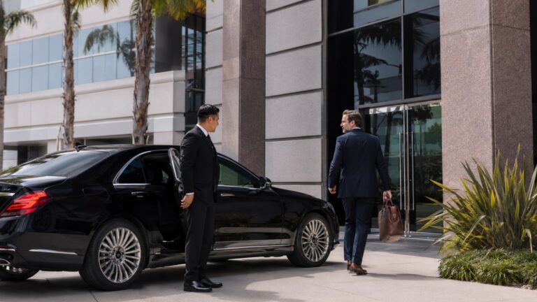 Professional Chauffeur for Business Travelers in San Diego executive office drop-off with black sedan